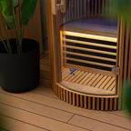 Wooden sauna with a plant on a wooden deck