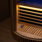 Wooden sauna bench with glowing interior in a dimly lit room