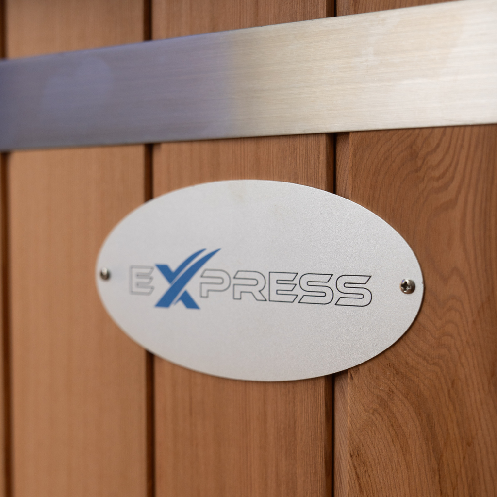 Metallic 'EXPRESS' logo on a wooden surface