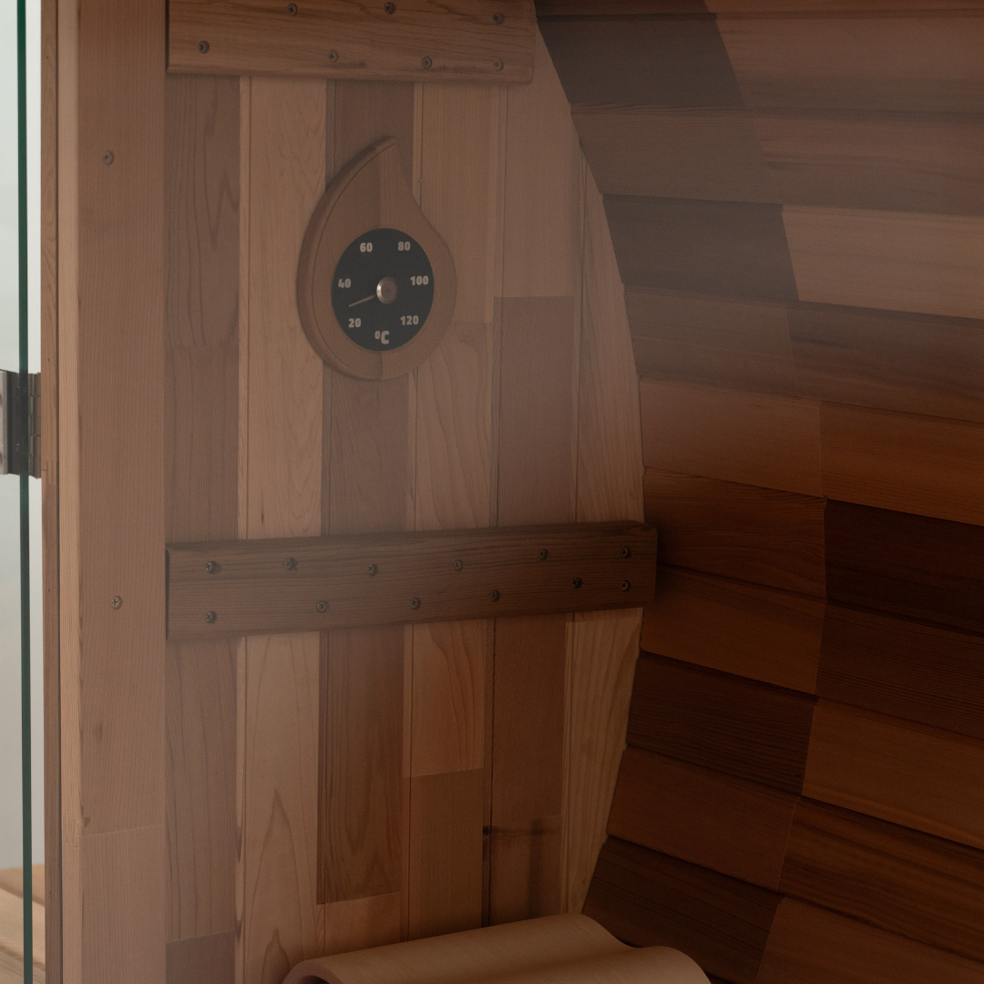 Wooden sauna with a digital clock on the wall