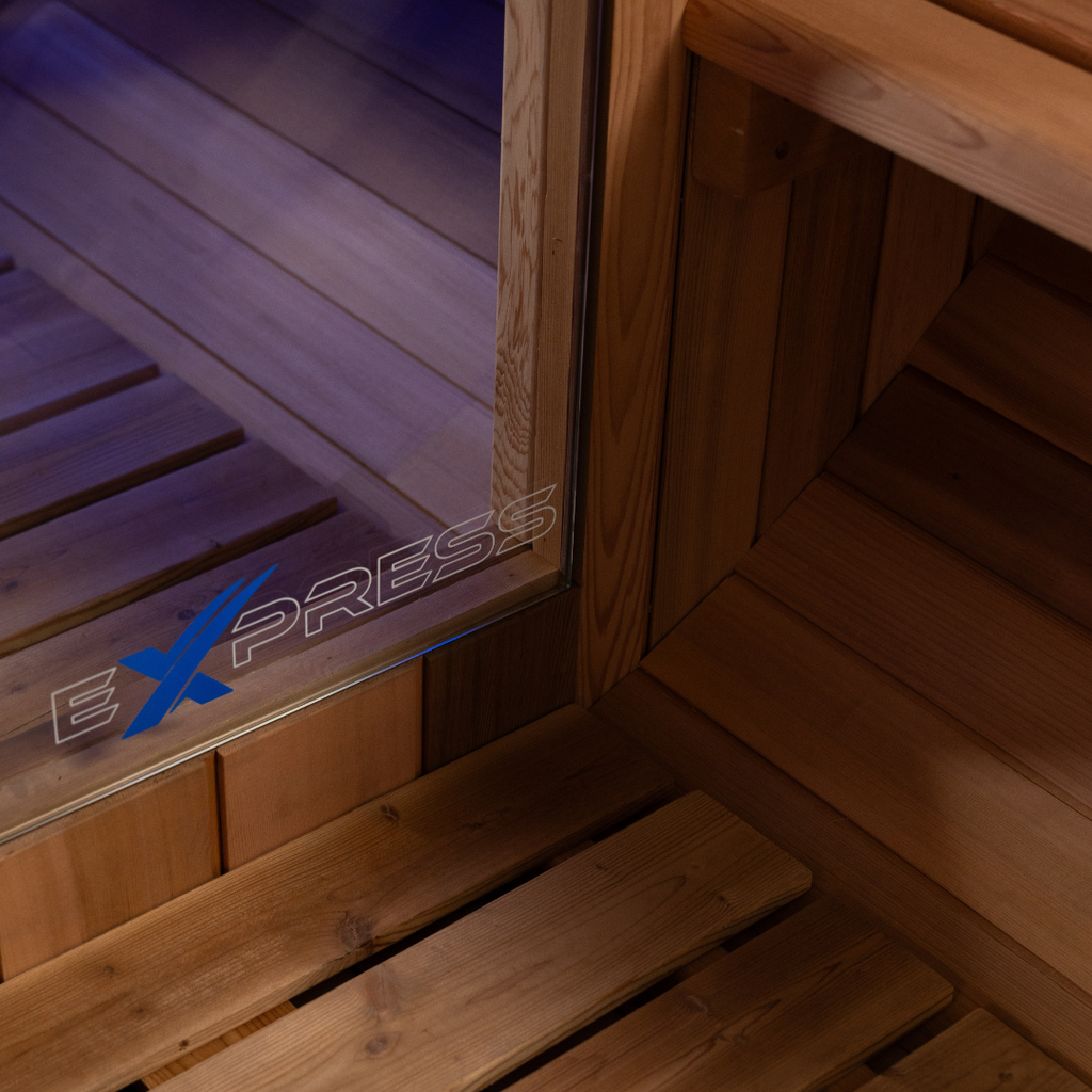Wooden sauna interior with 'ExPress' logo on a glass panel