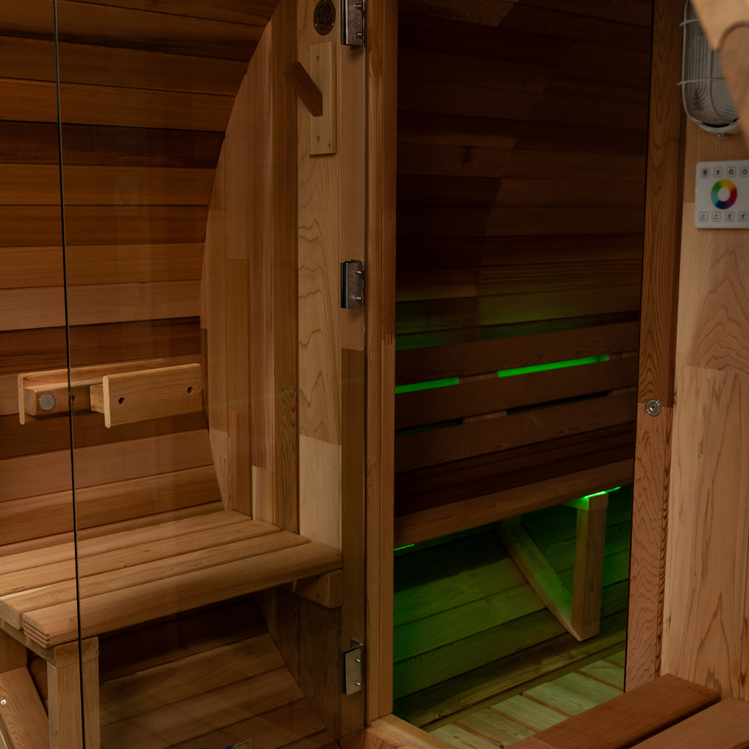 Wooden sauna interior with green lights on the floor